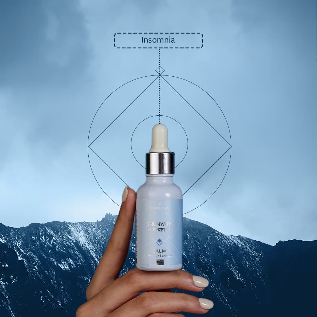 A hand model holding a bottle of Shunyata Calm that helps people suffering from insomnia